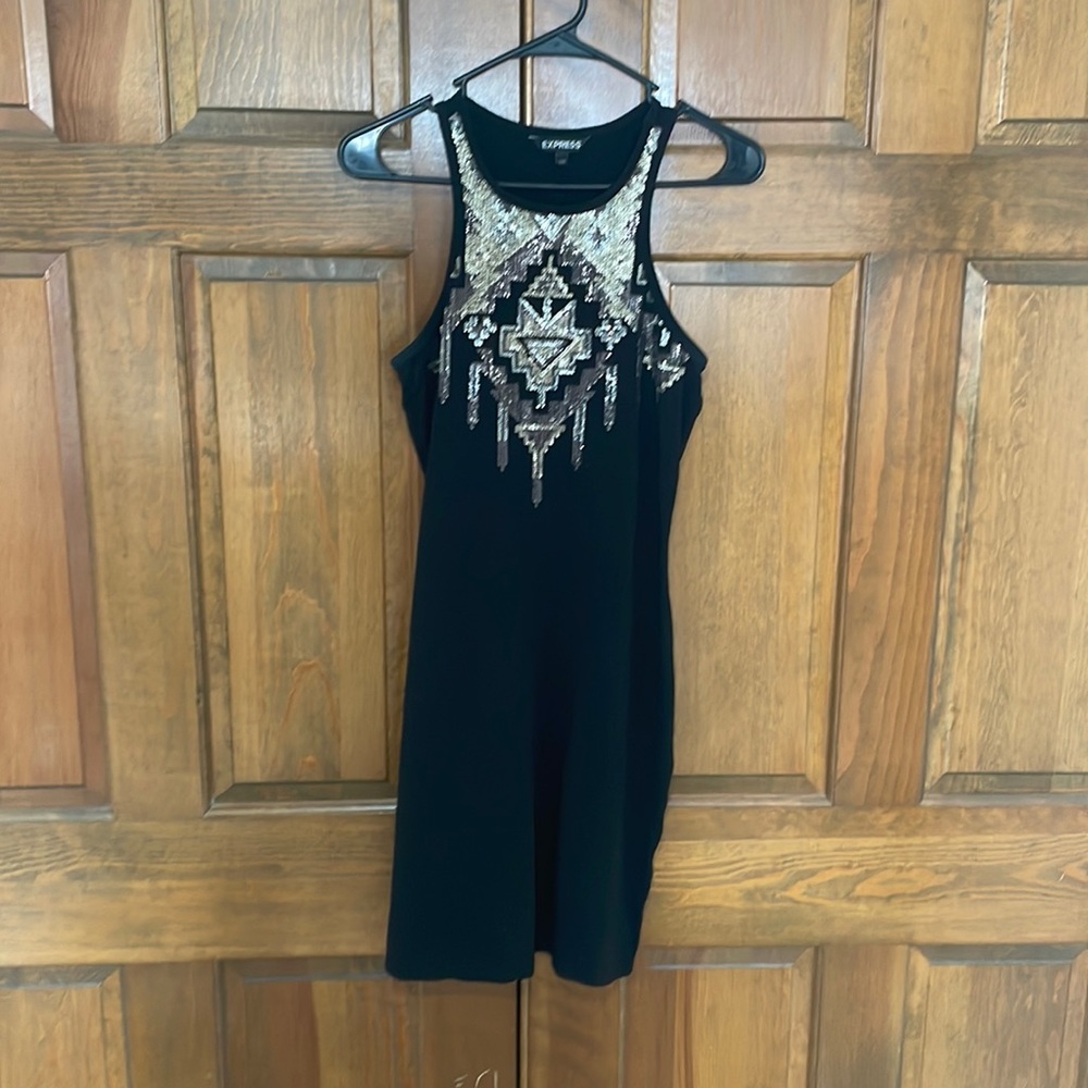 Woman’s black dress with gold and silver sequence